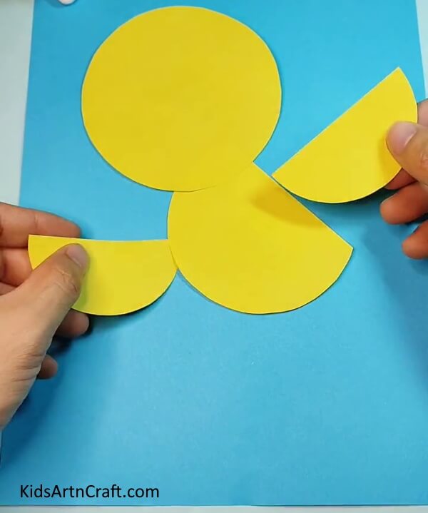 Make two semicircles with yellow craft paper- Paper Bird Crafting – A Step-by-Step Tutorial