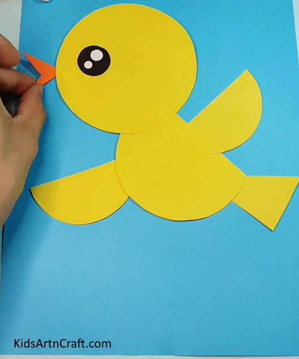 Make beak with orange craft paper- Step-by-Step Directions to Making a Paper Bird