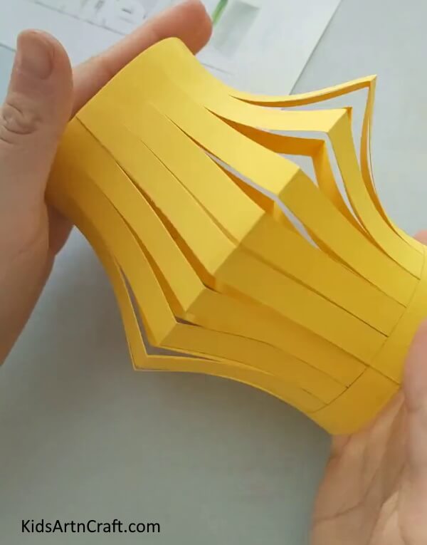 Press The Cylindrical Shape Inwards to Easy Paper Fish Craft- Tutorial to aid in the construction of a paper fish project for young ones. 