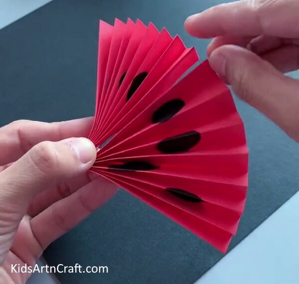 Fold And Secure The Whole Design with the hands for Easy Paper Ladybug Craft