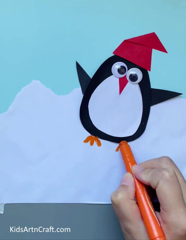 Drawing a Pair Of Claws-Making a Do-It-Yourself Paper Penguin Activity For Preschoolers
