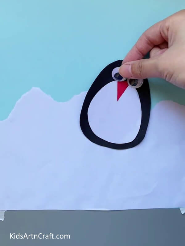 Giving It a Pair Of Eyes-Preschoolers can successfully assemble a paper penguin craft