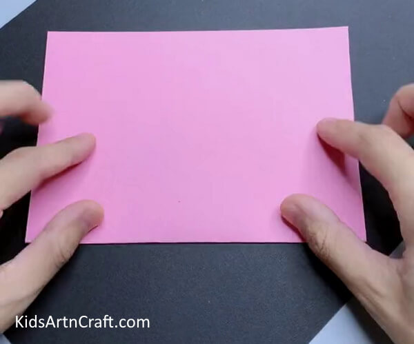 Folding A Pink Paper-A guide to making a paper pig craft with children