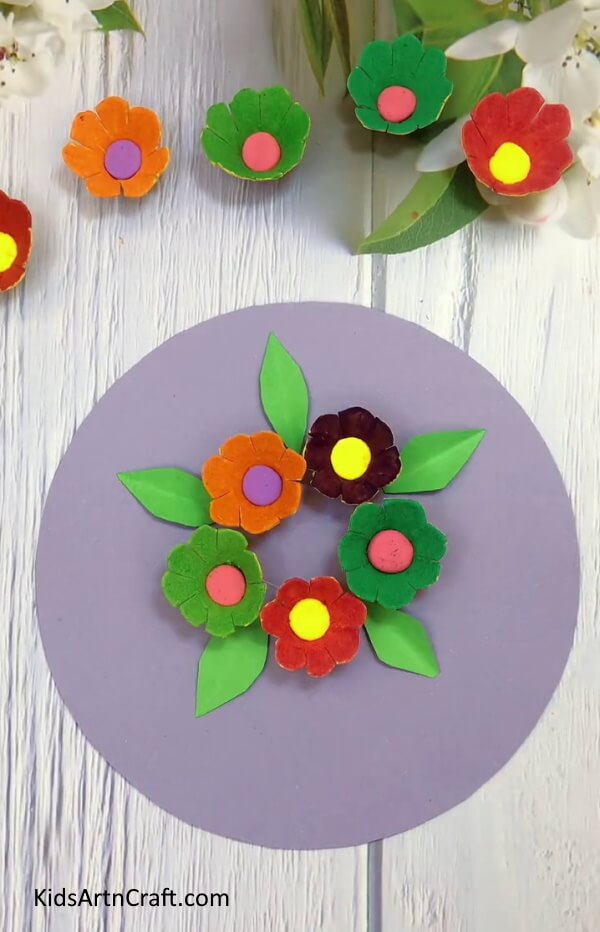 Pasting More Leaves - Crafting a flower out of a recycled egg carton in the home.