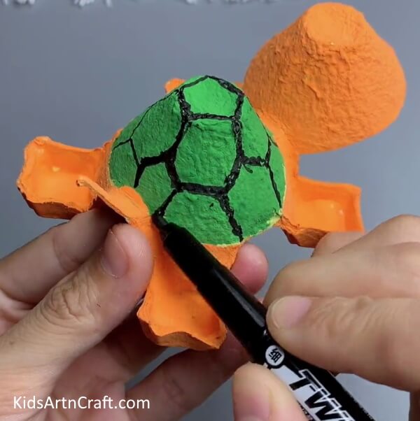 Drawing The Patterns On The Shell - Let Your Kids Create a Turtle Craft with an Upcycled Egg Carton