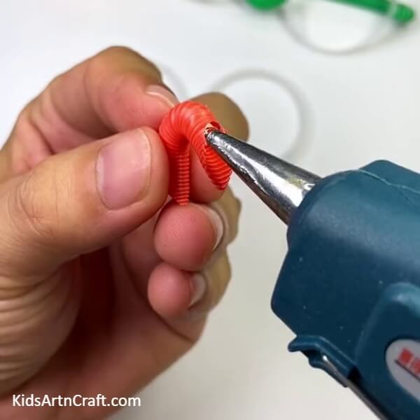 Using The Glue Gun- Crafting Eye Glasses from a Plastic Bottle and Straw? Here's a step-by-step tutorial. 