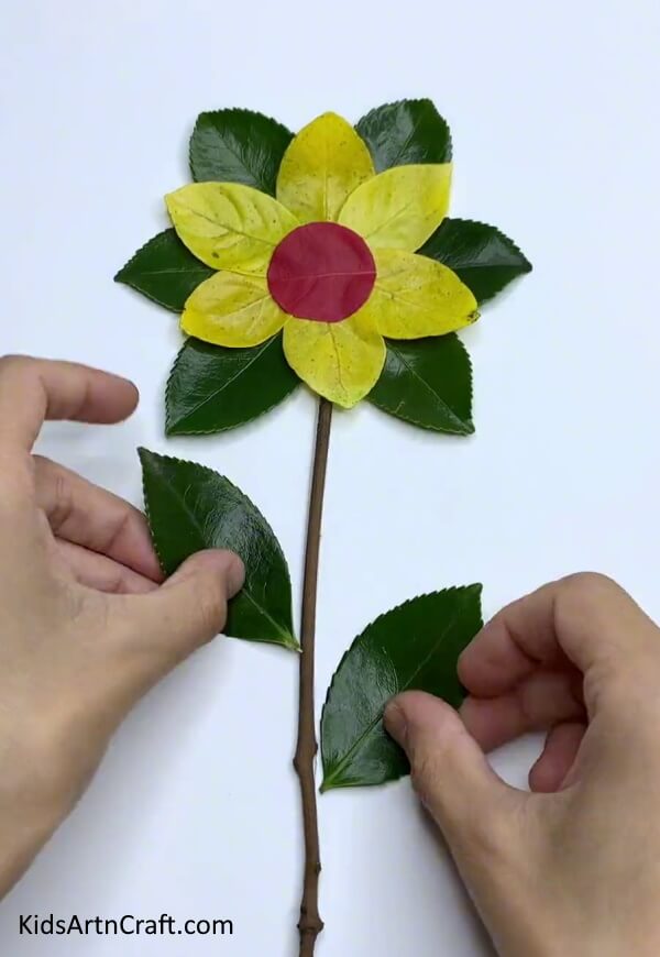 Pasting The Leaves On The Stem- An easy tutorial for making a flower craft from fresh leaves 