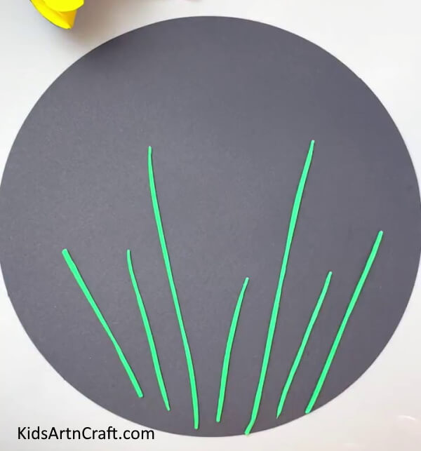 Making Green Stems On The Black Paper - Instructions for Children to Create DIY Garden Bees with Clay