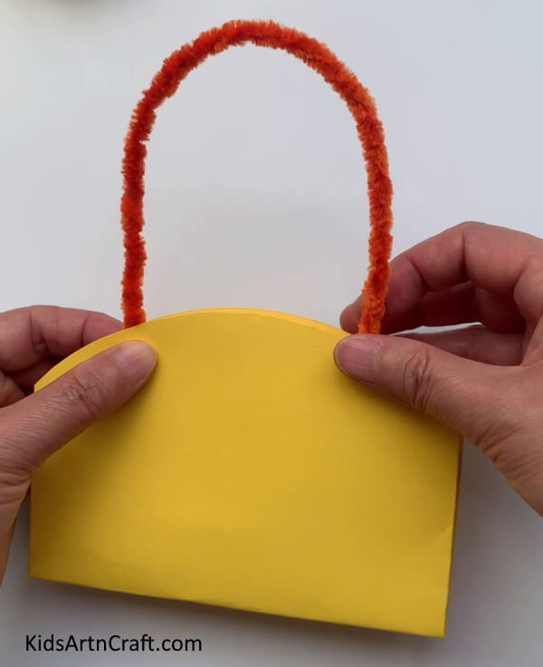 Attaching Pipe Cleaner On The Paper Bag -Crafting an Artisanal Paper Bag for a Present with Handles