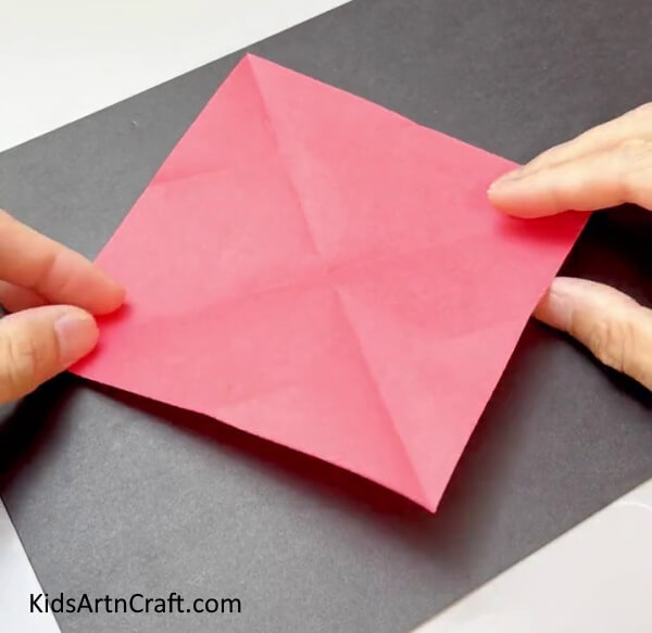 Making Creases On Square Paper - Create your own fan with vivid paper for children.