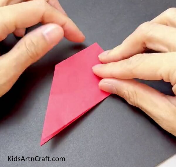 Pasting Corners Together - Construct a handheld fan out of multi-colored paper for youngsters.