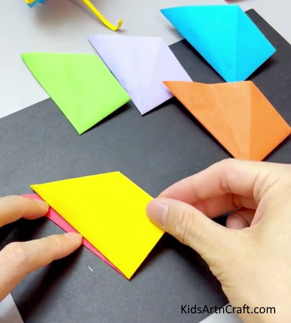 Pasting Models Together - Construct a fan with exciting paper for kids.