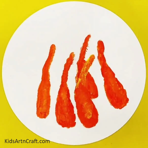 Making More Carrots - Let your kids paint a basket with a handprint-shaped carrot inside.