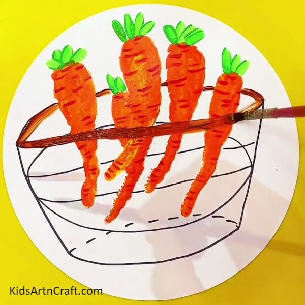 Making A Basket - An enjoyable art project for the kids: paint a hand impression carrot in a basket. 