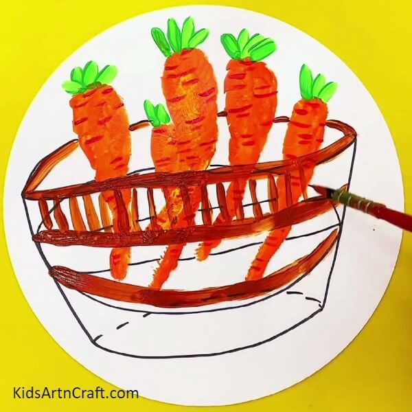 Detailing The Basket - Let the kids make a handprint-shaped carrot in a basket painting.