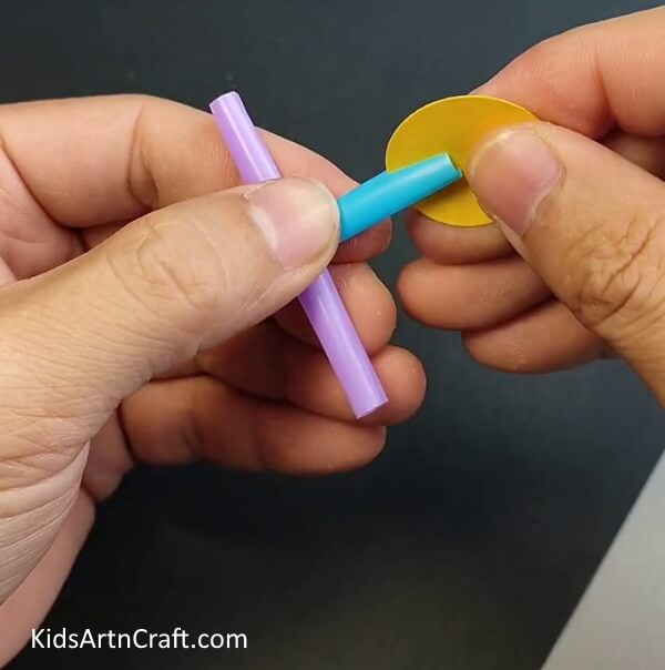 Insert the Different Craft Papers in the Cut Side of the Straw- Building a Straw Hand Fan - A User-friendly Tutorial for Little Ones 