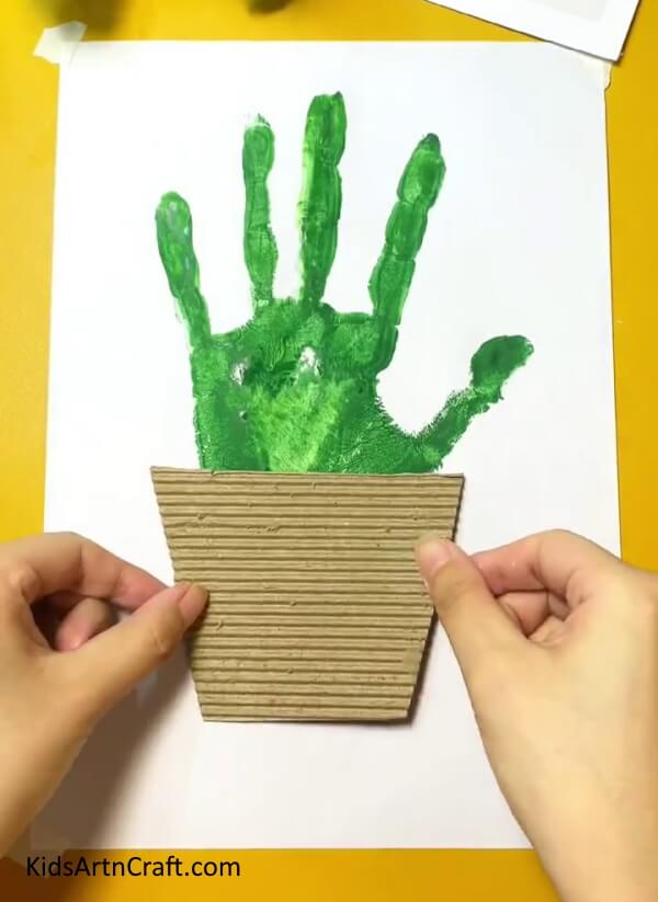 Making the Pot for the Plant- Show your kids how to create a Cactus handprint design in the comfort of your own home. 