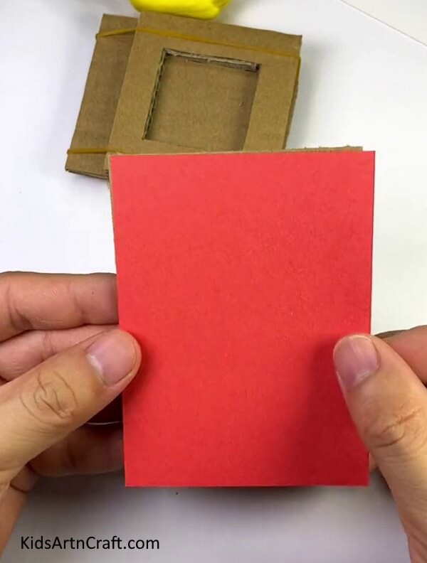 Pasting Red Paper On Cardboard- A Tutorial Explaining How to Construct a Heart Shooter for Children
