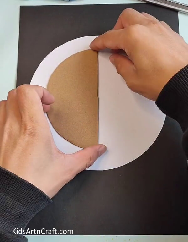 Cutting Circle-Shaped Cardboard into Half-A Kid's Activity to Make a Hedgehog Leaf Craft 