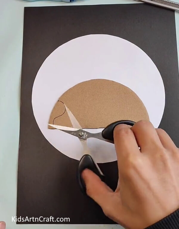 Cutting Cardboard to Make the Face of a Hedgehog-A Guide for Kids to Make a Hedgehog Leaf Art Project