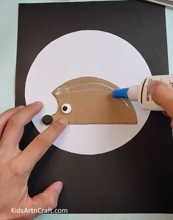 Applying Some Glue on Hedgehog's Body-Making a Hedgehog from Leaves - A Tutorial for Kids
