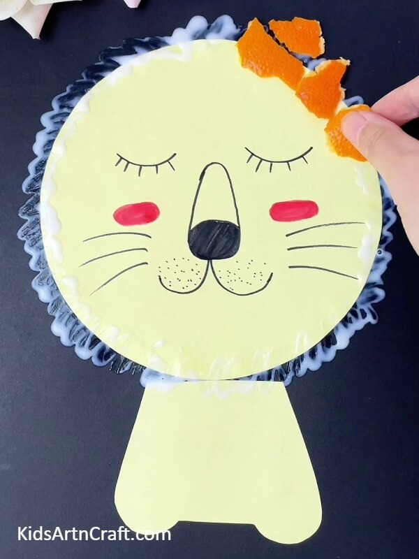 Pasting Orange Peels- Fabricating a Lion Expression Art Form with Orange Peelings