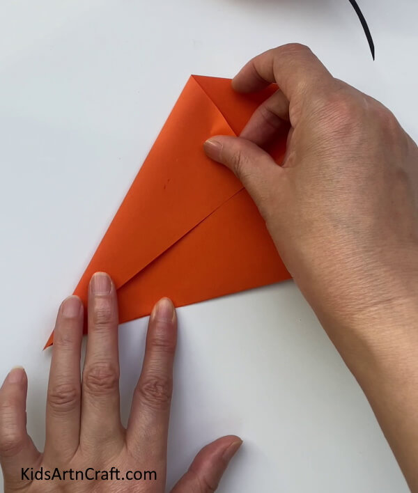 Folding The Corners To The Crease Making a Moving Lobster Craft Out of Paper For Youngsters