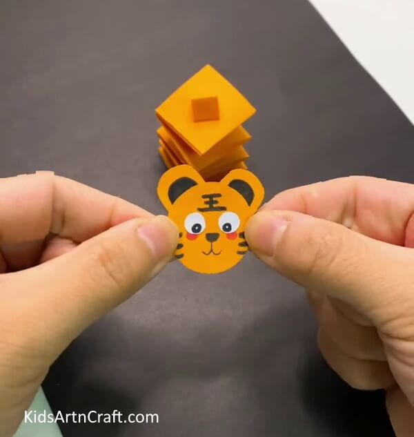 Give It a Pair Of Ears-Create a moving paper tiger with your children.