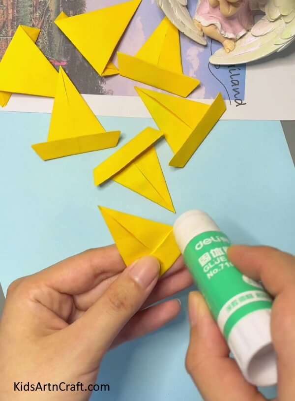 Glue each Origami Paper- Learn How to Create an Origami Paper Crown with Kids
