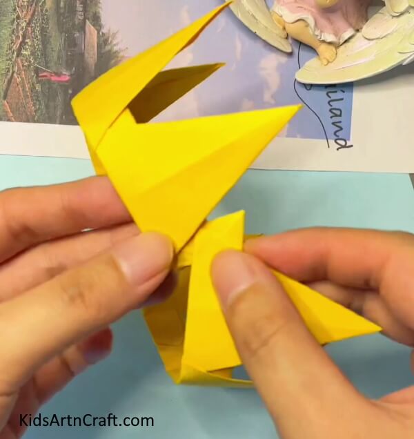 Glue the last two to get a Origami Crown- A Tutorial for Constructing an Origami Paper Crown with Kids