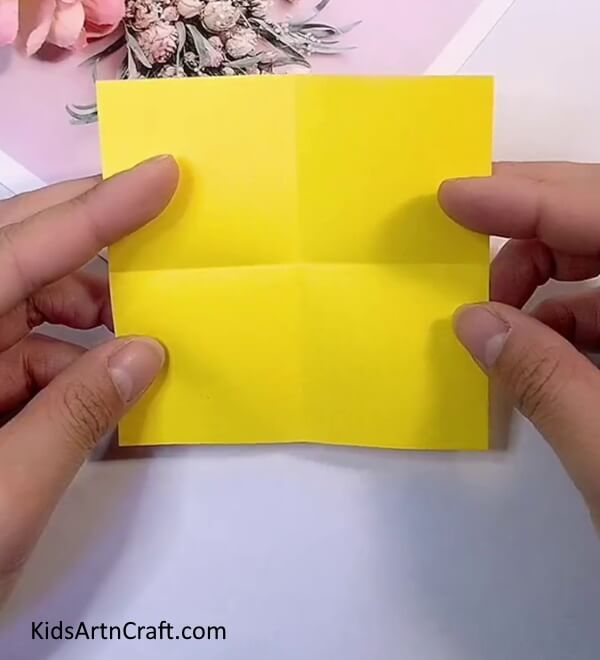 Folding Paper Into Halves And Form Creases-Making Origami Flowers with Paper - A Simple Activity for Kids