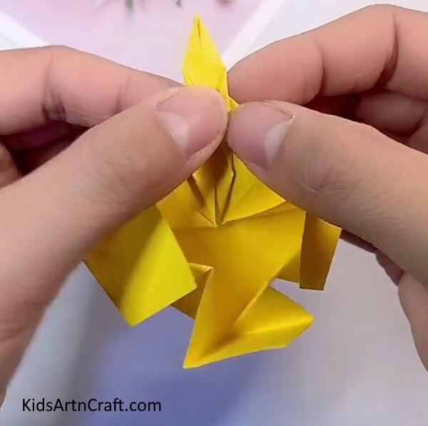 Folding The Sides Of The Rhombus-Crafting an Origami Flower with Paper - a Simple Task for Children 