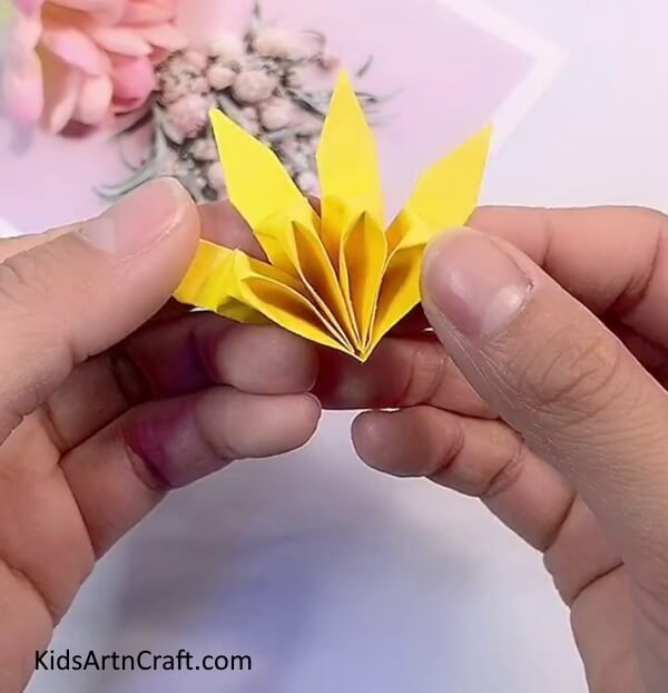 Glueing The Small Petals-Crafting a Paper Origami Flower - An Easy Job for the Kids
