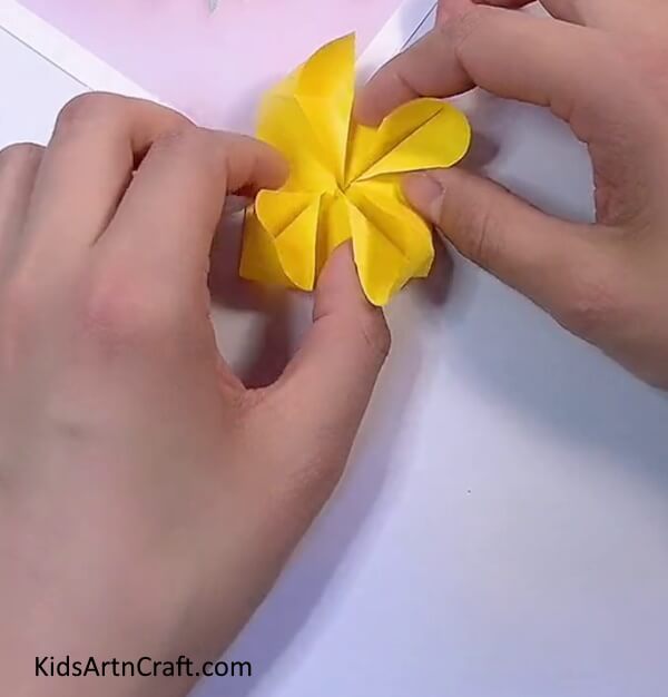 Pulling Out Corners Of Paper-Crafting an Origami Flower with Paper - An Entertaining Challenge for Children 