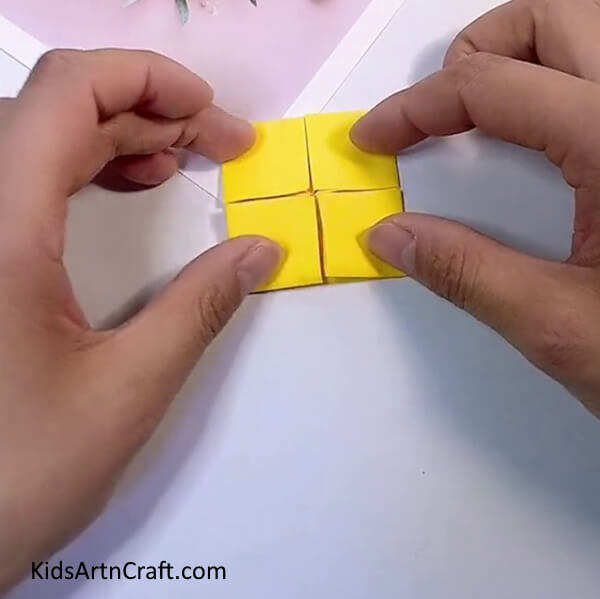 Forming 4 Squares In A Square-Making a Paper Origami Flower - A Pleasurable Task for Kids 