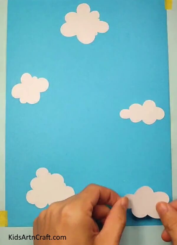 Pasting More Clouds- Create Your Own Paper Bee with this Kid-Friendly Tutorial