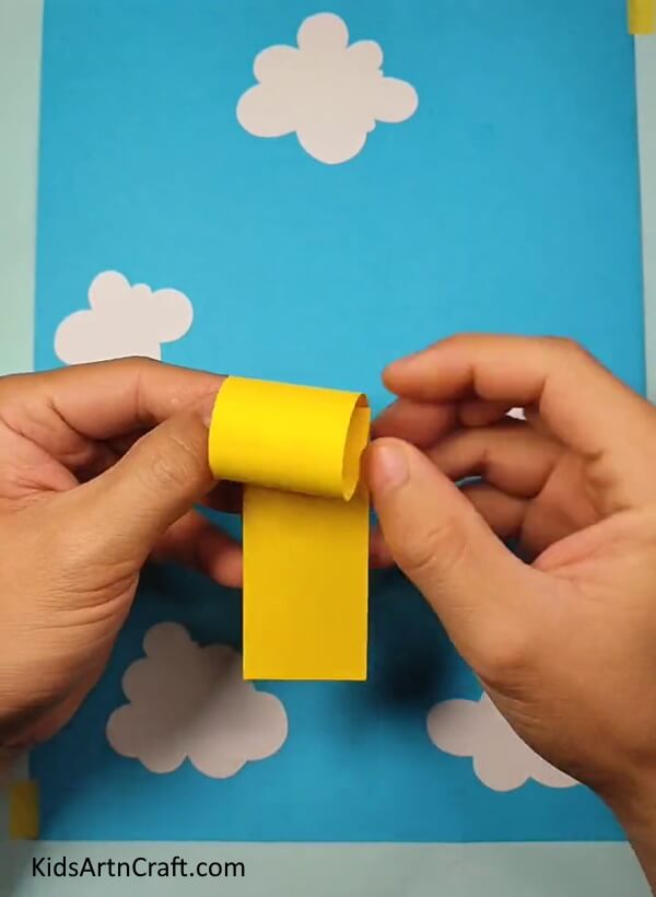 Rolling Over The Strips- Step-by-Step Instructions for Crafting a Paper Bee for Kids