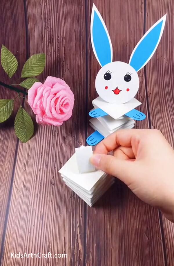 Sticking The Small Strip Atop Your Bunny's Body-Create a Paper Bunny for Easter Decorations