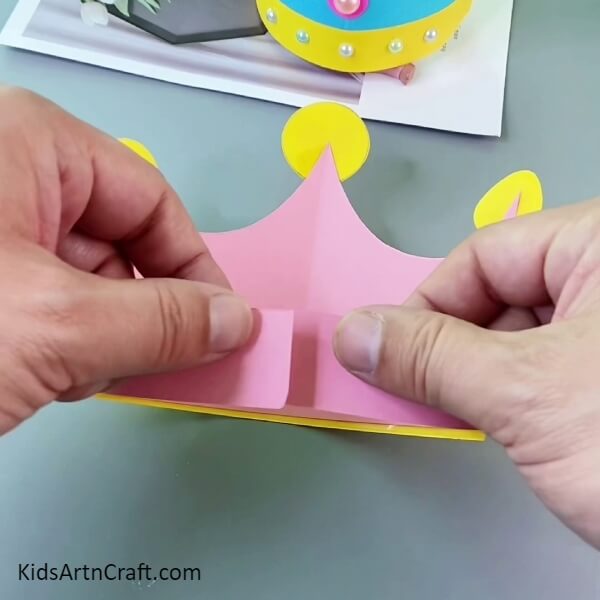 Attaching Both Ends Of The Strip- Crafting a Paper Crown for Kids