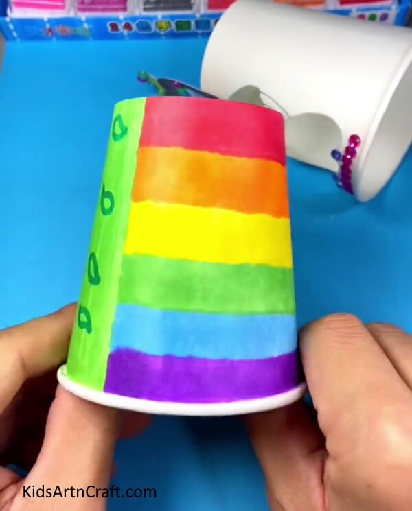 Drawing rainbow pattern design for doll dress- An enjoyable craft project for kids to make their own paper cup changing dress dolls.
