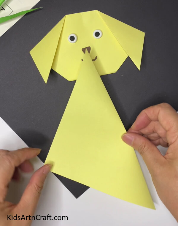Folding The Paper Walk-through for creating a paper dog craft easily for young ones 
