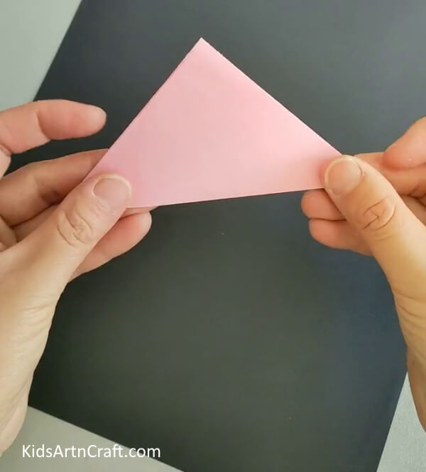 Folding Along The Crease- Get instructions on how to construct a Kusudama Paper Flower Origami via a DIY tutorial.