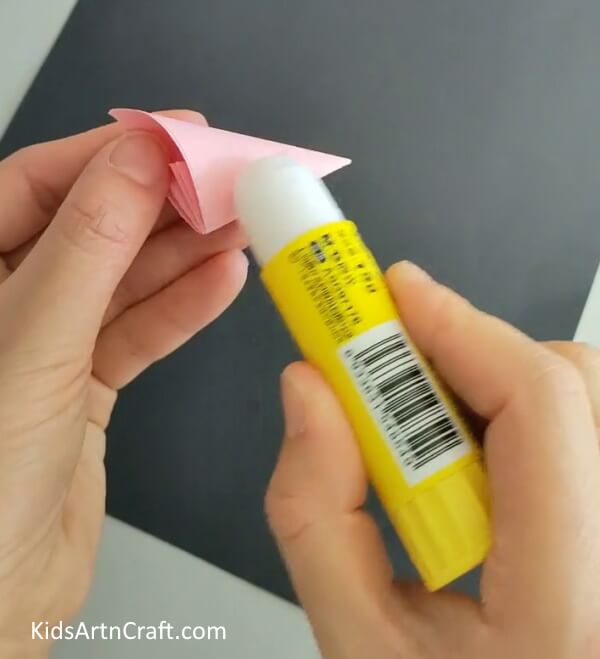 Applying Gluestick Over The Petal- A DIY tutorial will teach you the steps to making a Kusudama Paper Flower Origami.