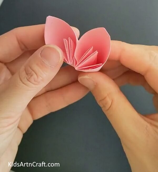Pasting Another Petal To The One- Get the directions to make a Kusudama Paper Flower Origami with a DIY tutorial
