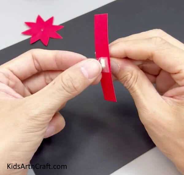 Securing The End Of The Paper Stick - Learn how to create a Paper Flower Ring with this DIY tutorial