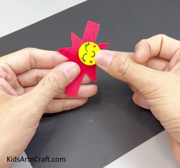 Adding Smiley To The Red Flower - Instructions to craft a Paper Flower Ring for kids 