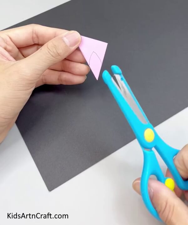 Cutting The Flower - Learn how to create a Paper Flower Ring with this tutorial designed for kids