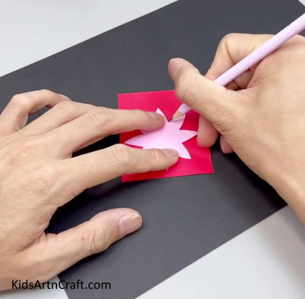 Tracing The Flower On Red Paper - Tutorial on assembling a Paper Flower Ring for children