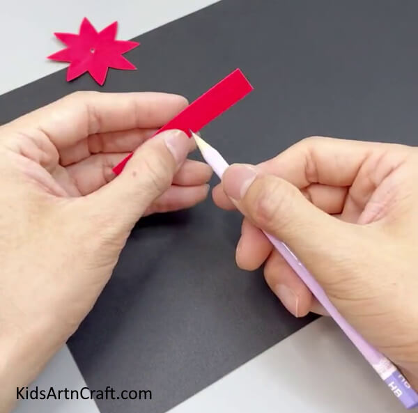 Making Hole In Rectangular Strip - Making a Paper Flower Ring - a tutorial for kids