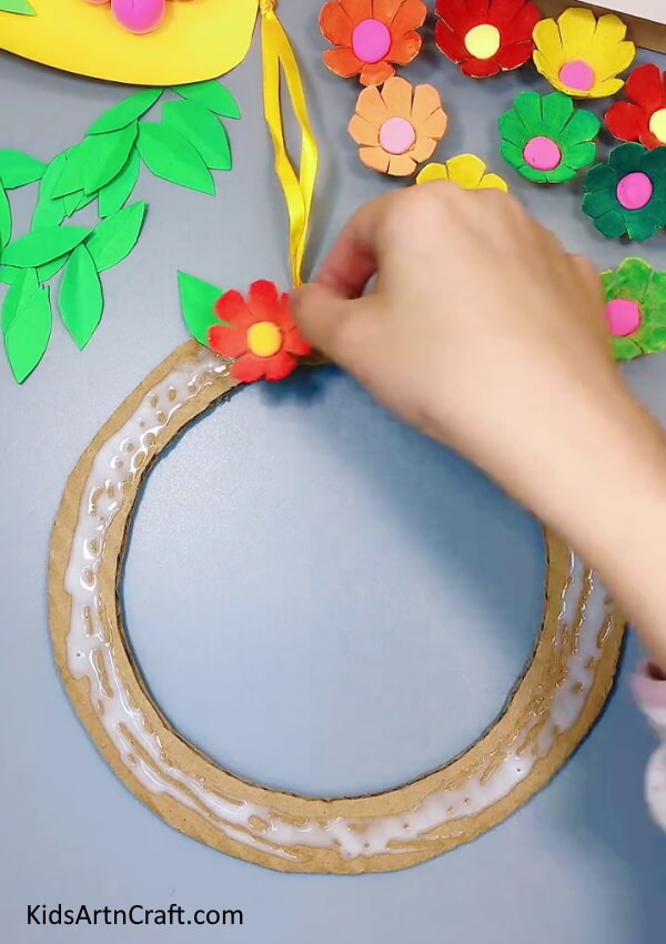 Pasting A Flower - Decorate with a Do-It-Yourself Egg Carton & Paper Flower Wreath